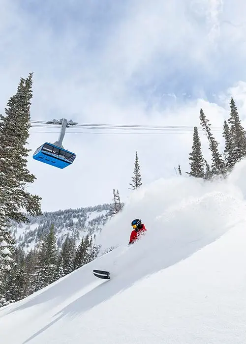 Mobile hero - Snowboarder under the Tram at Snowbird