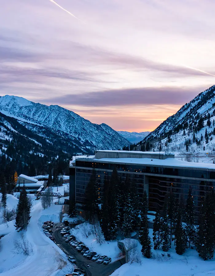 The Cliff Lodge at sunset, Snowbird's iconic slopeside lodge best for ski vacations