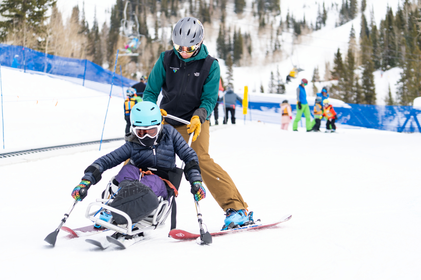 Community Outreach with Wasatch Adaptive Student in Sit Ski and Instructor
