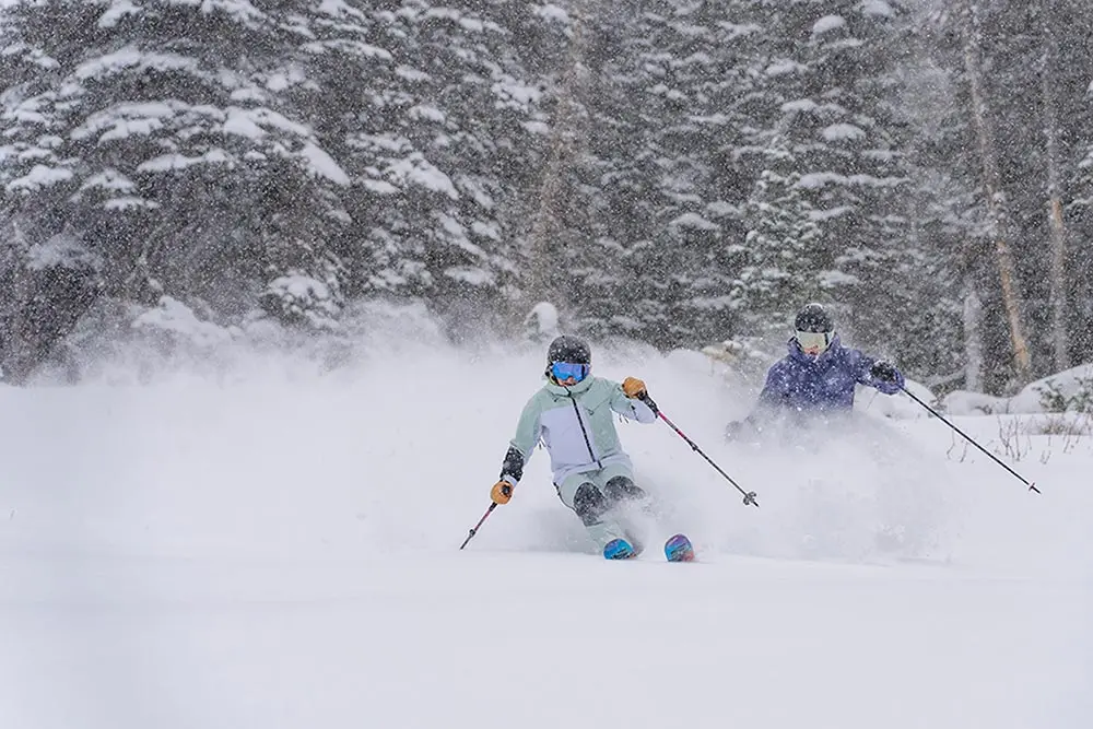 Snowbird season passholders skiing early season powder