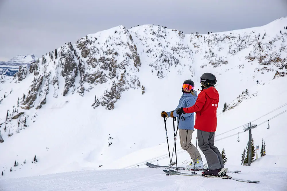 Women's Ski & Snowboard Camp - Women skier and instructor in Mineral Basin