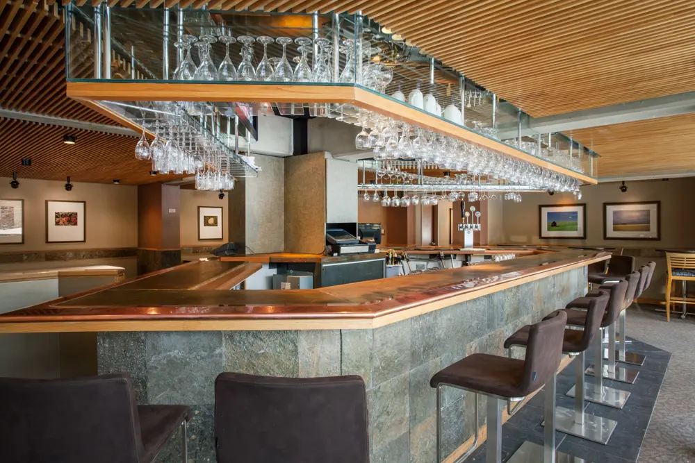 The lounge at the Lodge Bistro, a large wooden bar