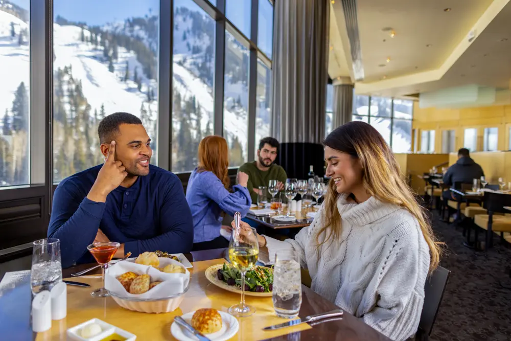 Couple sitting at the Aerie restaurant enjoying a meal