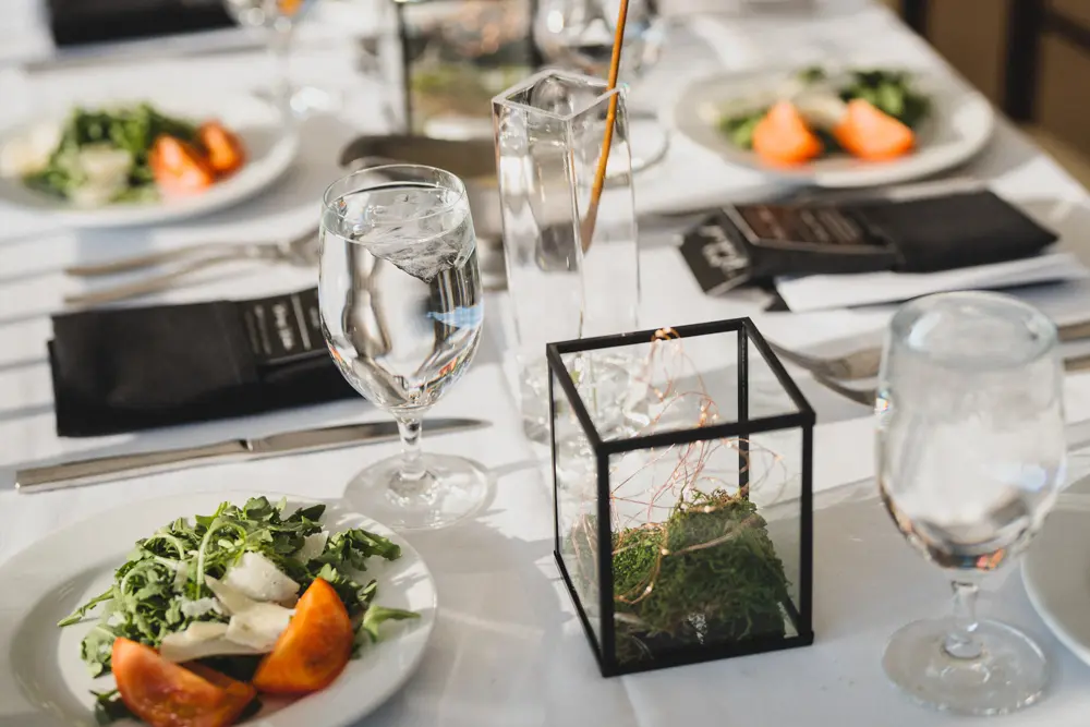 Close up of salad and table decorations at a Magpie Terrace wedding at Snowbird