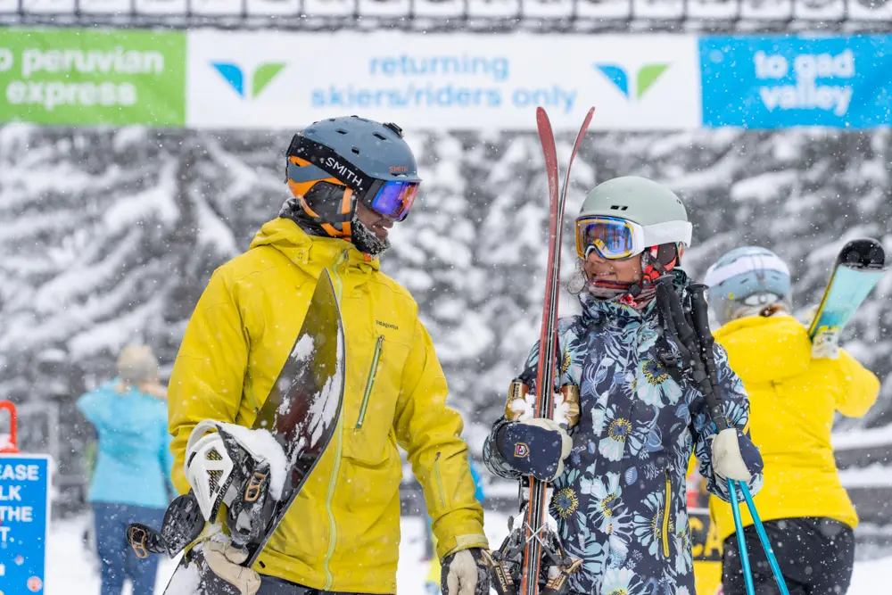 Father and daughter at a Family reunion walking with ski gear