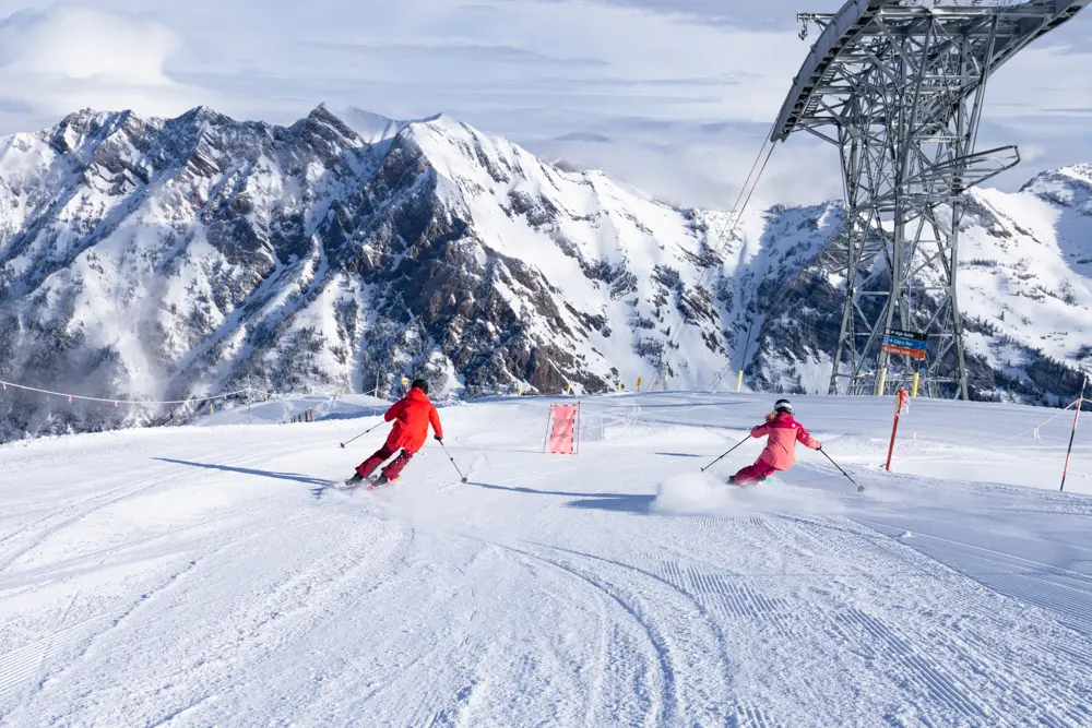 leisure group skiing together at Snowbird on a groomer