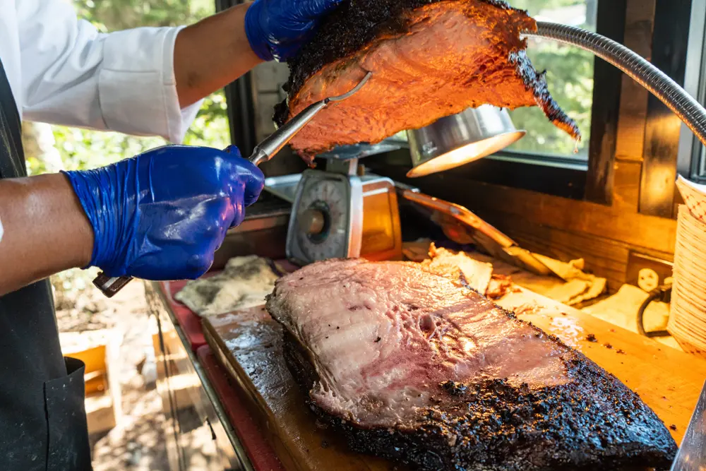 Prime rib getting carved, one of the options at Summer Activity packages includes barbecue meals