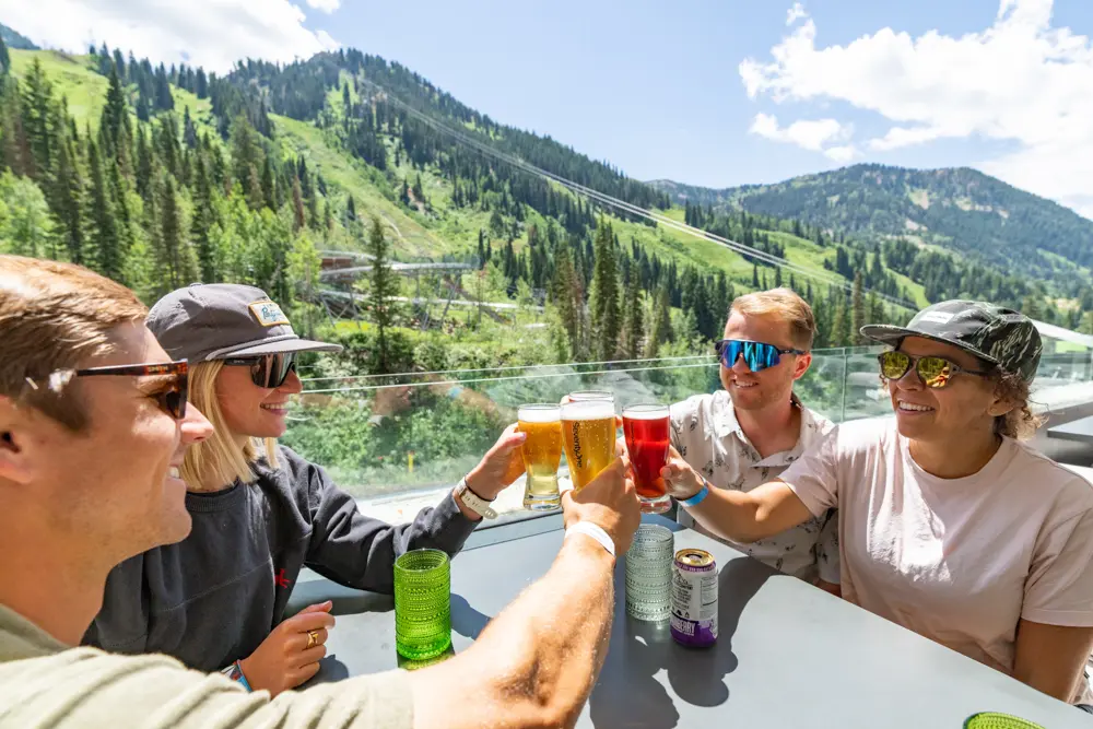 Group enjoys beers at Snowbird's SeventyOne deck during a group meeting