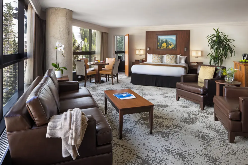 Couch and bed in a Snowbird Suite room, ideal for a wedding stay