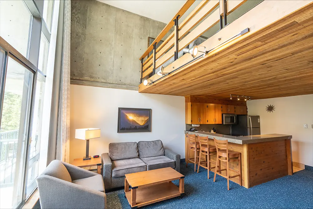 View of the studio loft at the Iron Blosam Lodge, the window that looks out towards the mountain and the kitchen