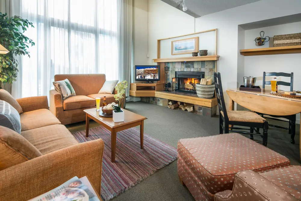 Fireplace and living area in The Inn's 1-bedroom condo lodging option