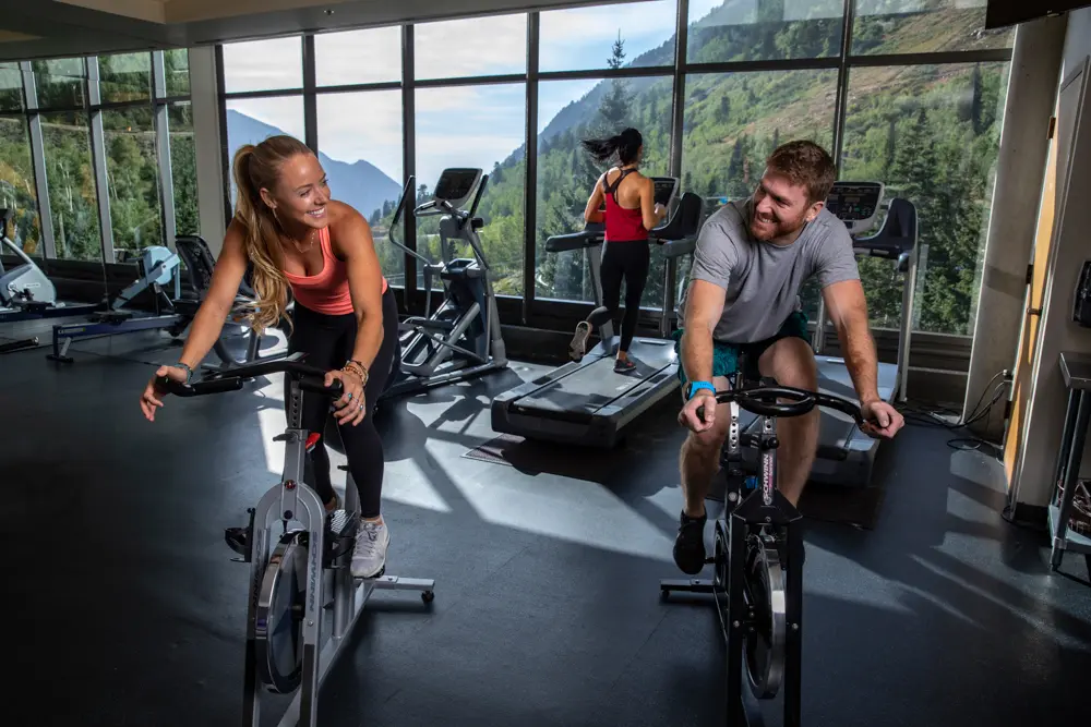 People biking in the gym at Snowbird's hotel