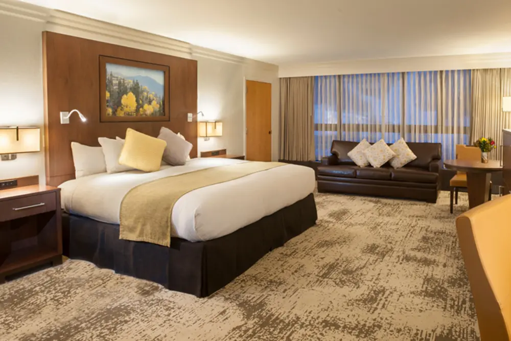Deluxe Bedroom at the Cliff Lodge - view of king bed and couch