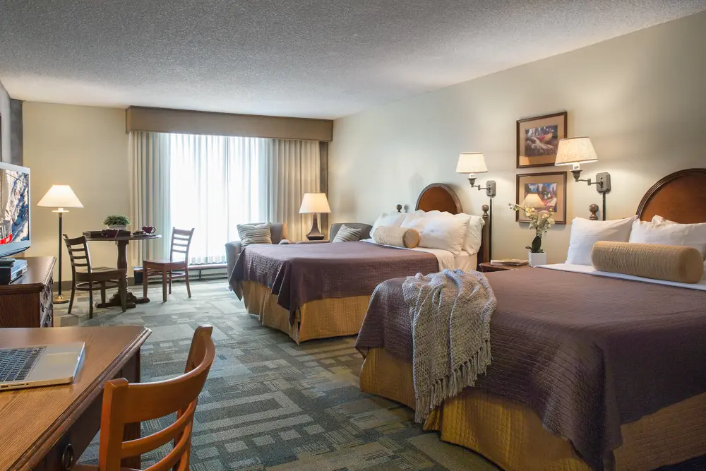 A bedroom at the Iron Blosam Lodge featuring 2 beds, one of Snowbird's lodging properites