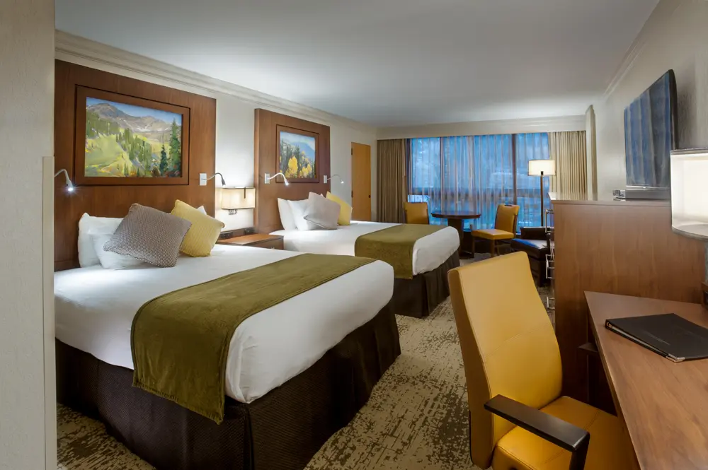 Cliff Lodge bedroom at Snowbird with 2 queen beds and a desk
