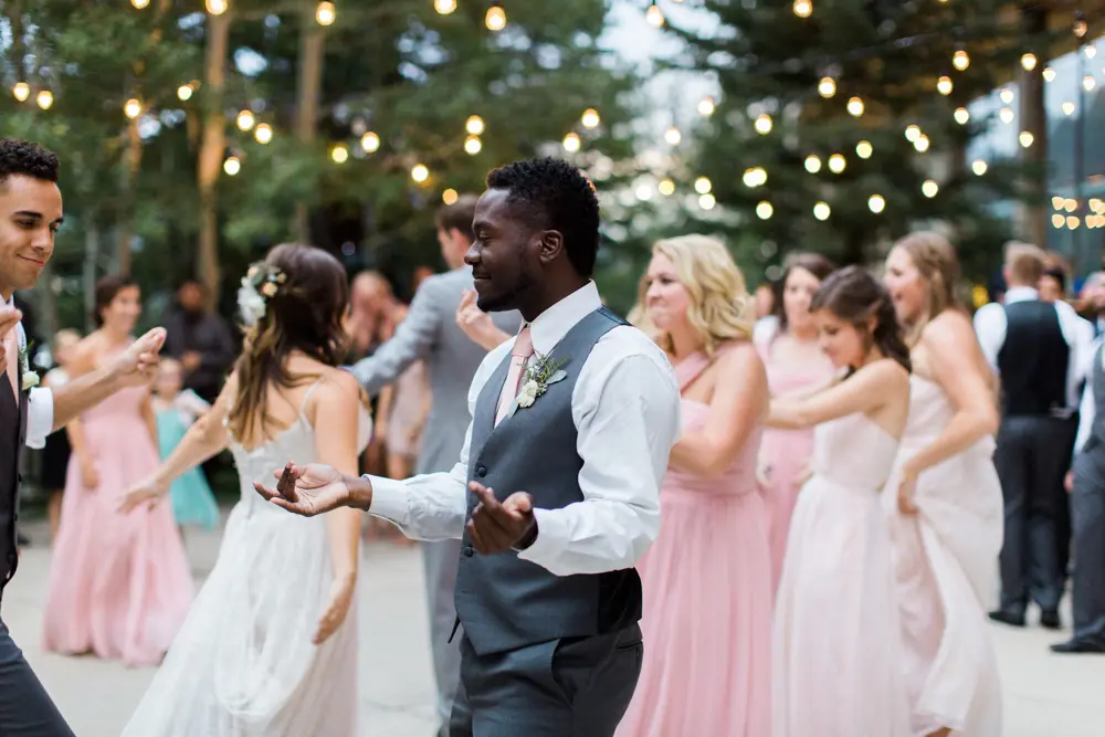 Guest dancing at an outdoor wedding venue at Snowbird