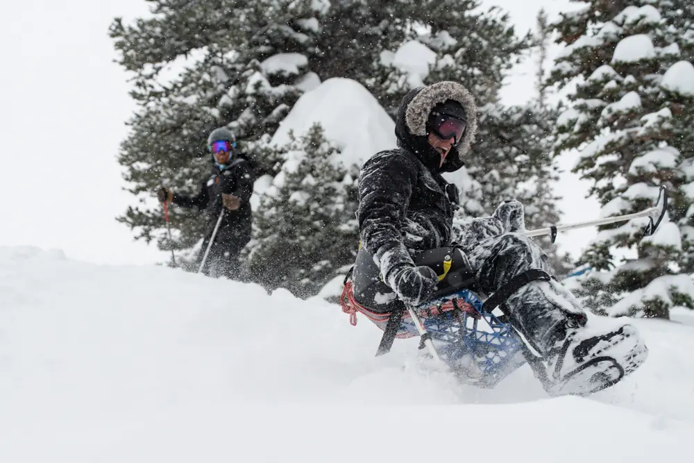 Sitskiers at Snowbird in powder with Wasatch Adaptive Sports