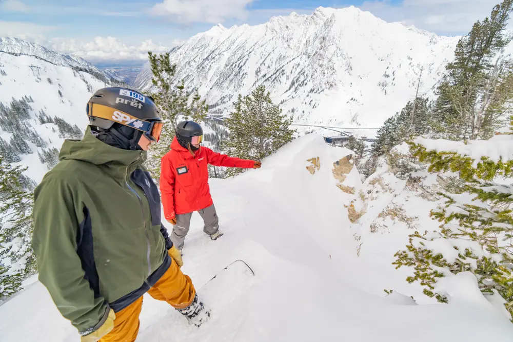 Mountain School Instructor points out a line to a guest during a private guiding adventure