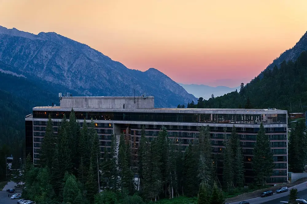 The Cliff Lodge at sunset with canyon views behind