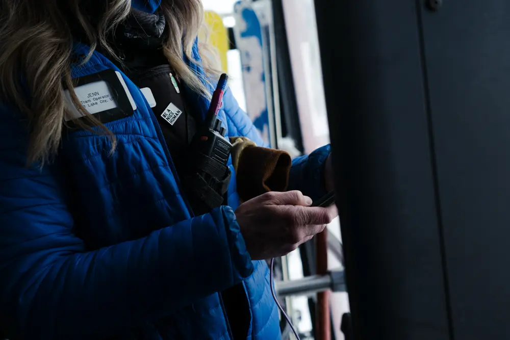 Zoomed in view of employee working on a lift at Snowbird