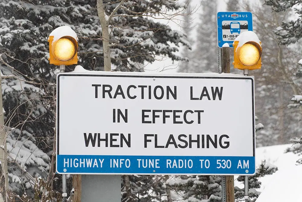 Traction law sign, flashing lights