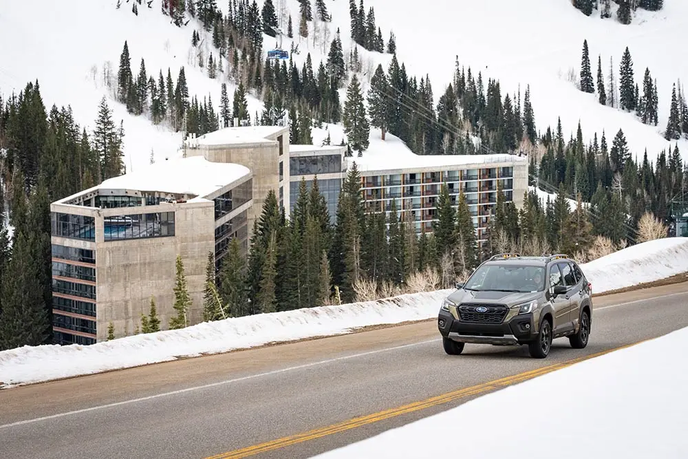 Subaru driving on the road past the Cliff Lodge