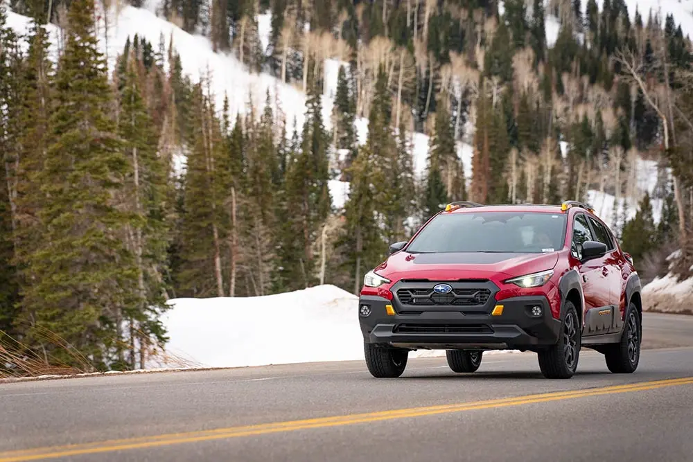 Subaru driving on Highway 210 to Snowbird in the winter
