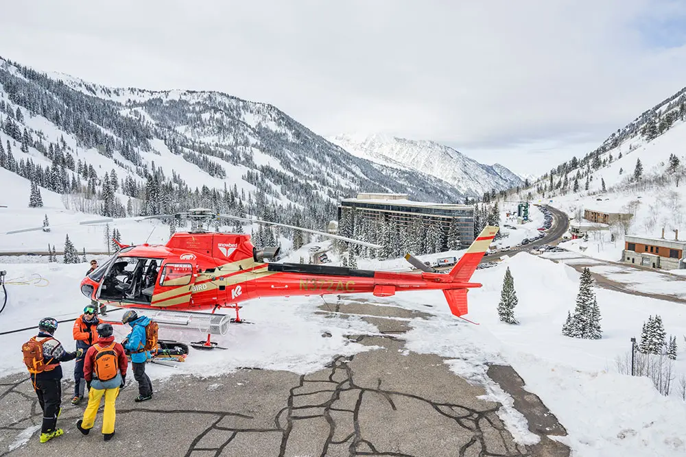 People load into a helicopter at the Powderbird helicopter port