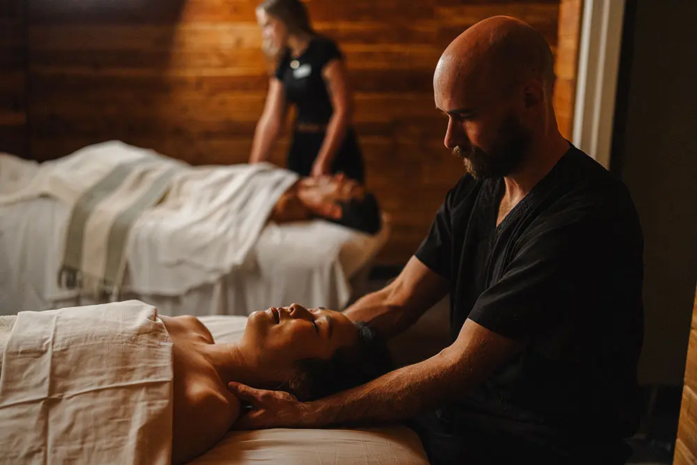 Couple receiving a couple's massage at the Cliff Spa at Snowbird