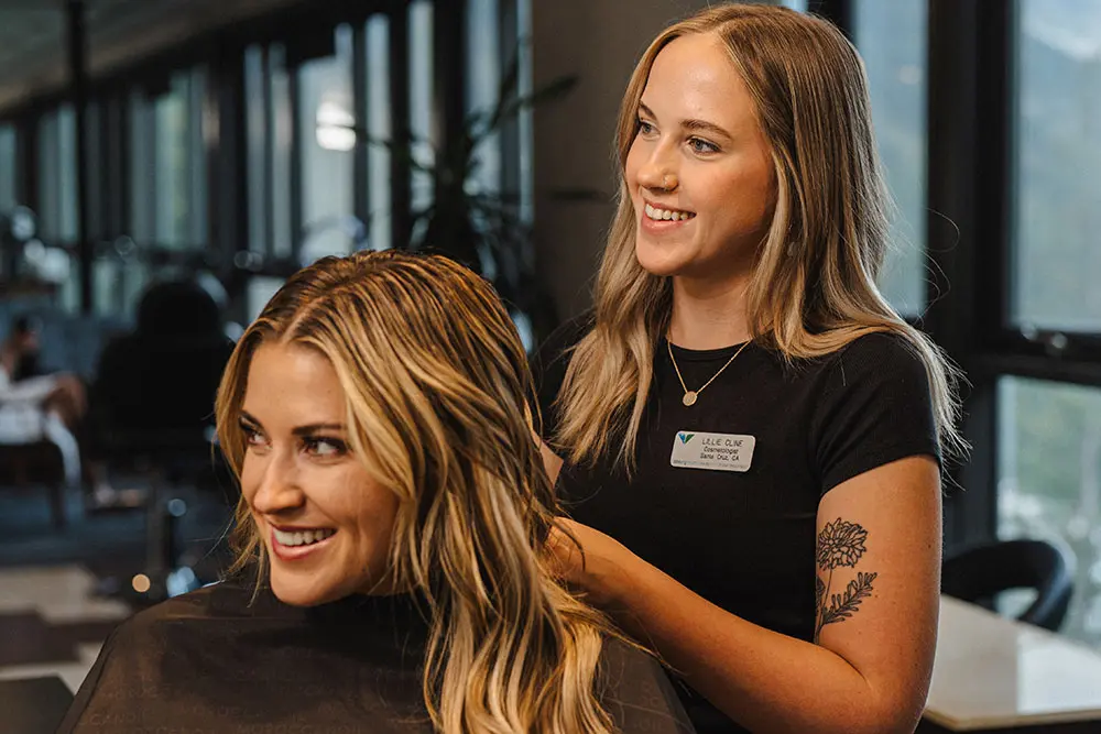 Woman receiving a haircut at Snowbird
