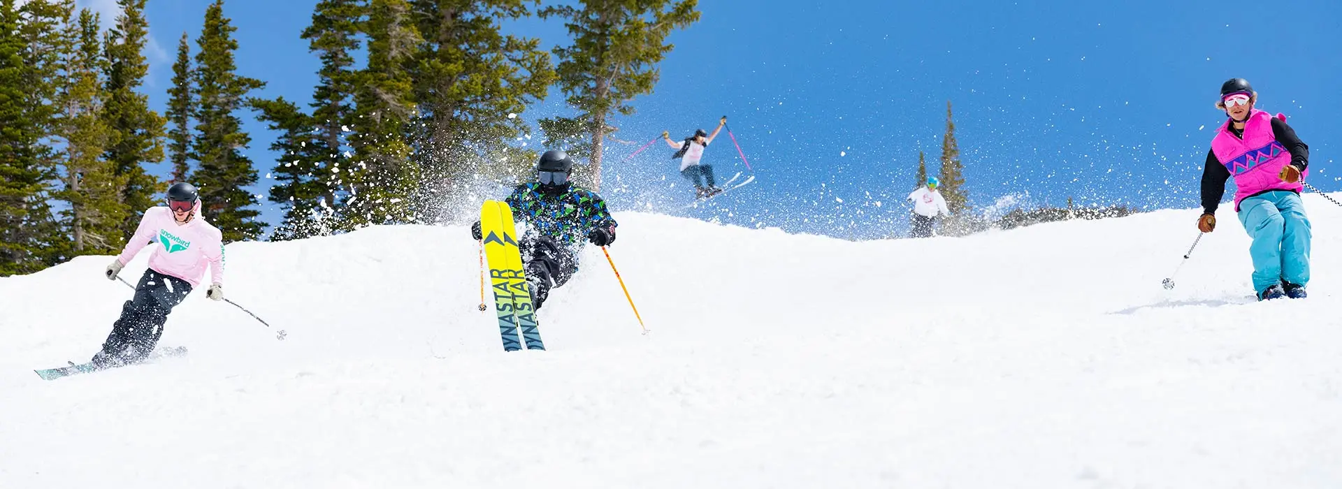 Skiers in spring skiing in Wings gear