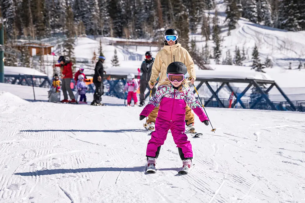 Family skis on Chickadee Hill Together