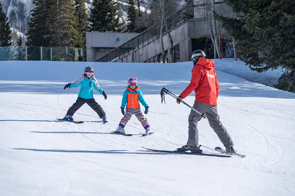 Mountain School Instructor leads students down Chickadee Hill during a Youth Ski and Snowboard Lesson at Snowbird
