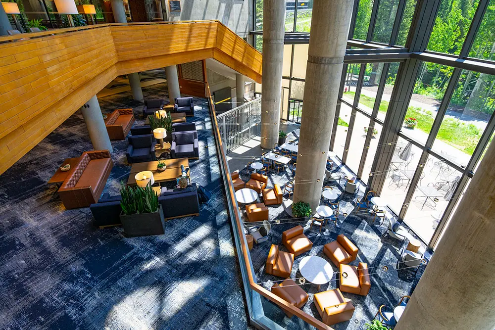 Snowbird's atrium cafe with floor-to-ceiling windows in the summer.