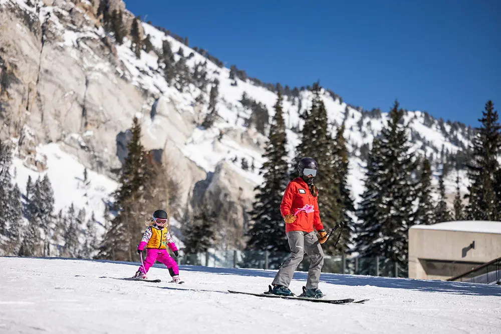 Girl skiing behind a Mountain School instructor on Chickadee Hill during a Youth Ski and Snowboard Lesson