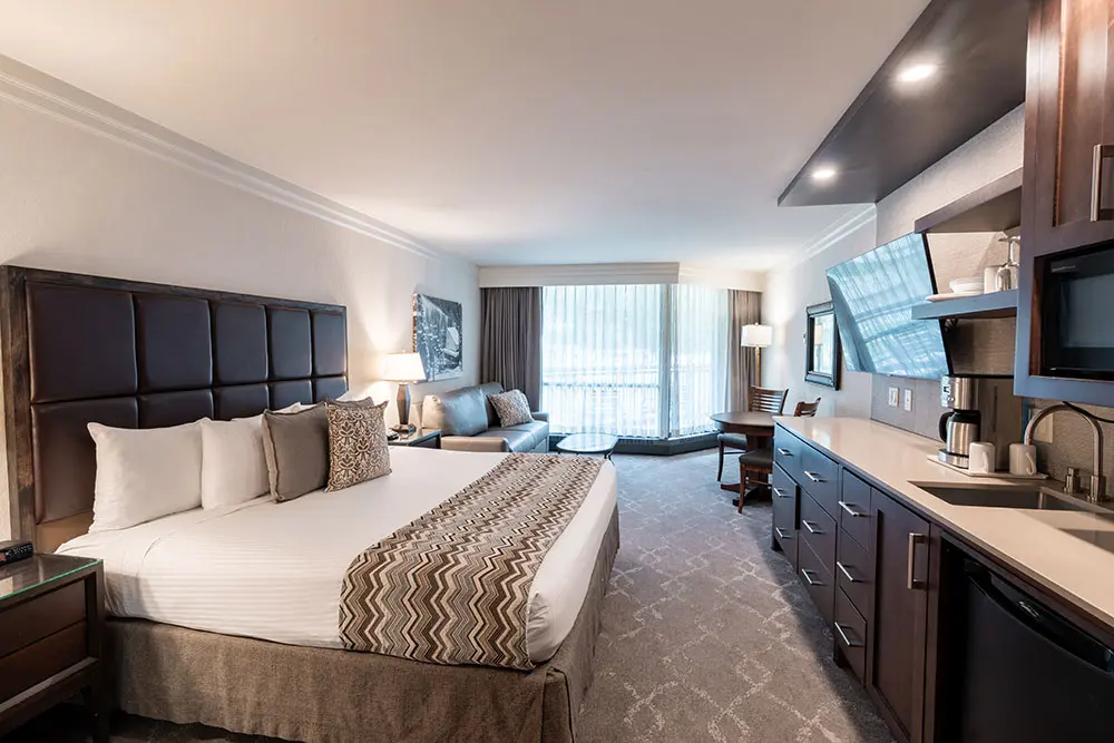 Bedroom with a king bed and a sink at the Cliff Club at Snowbird