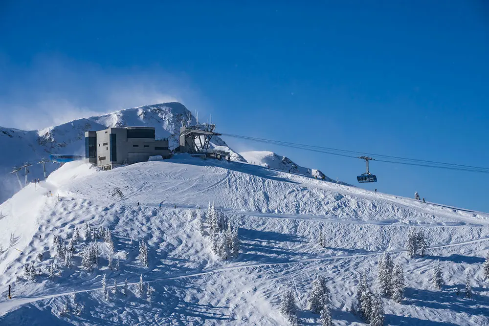 The Summit, Snowbird's mountain top lunch restaurant, from afar surrounded by mountains