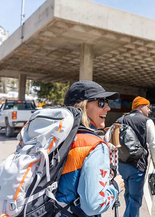 Mobile hero of people in wing apparel walking towards the Snowbird Center