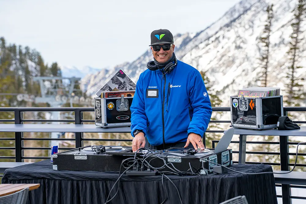 DJ Danny Z smiling while DJing at the Nest on the patio
