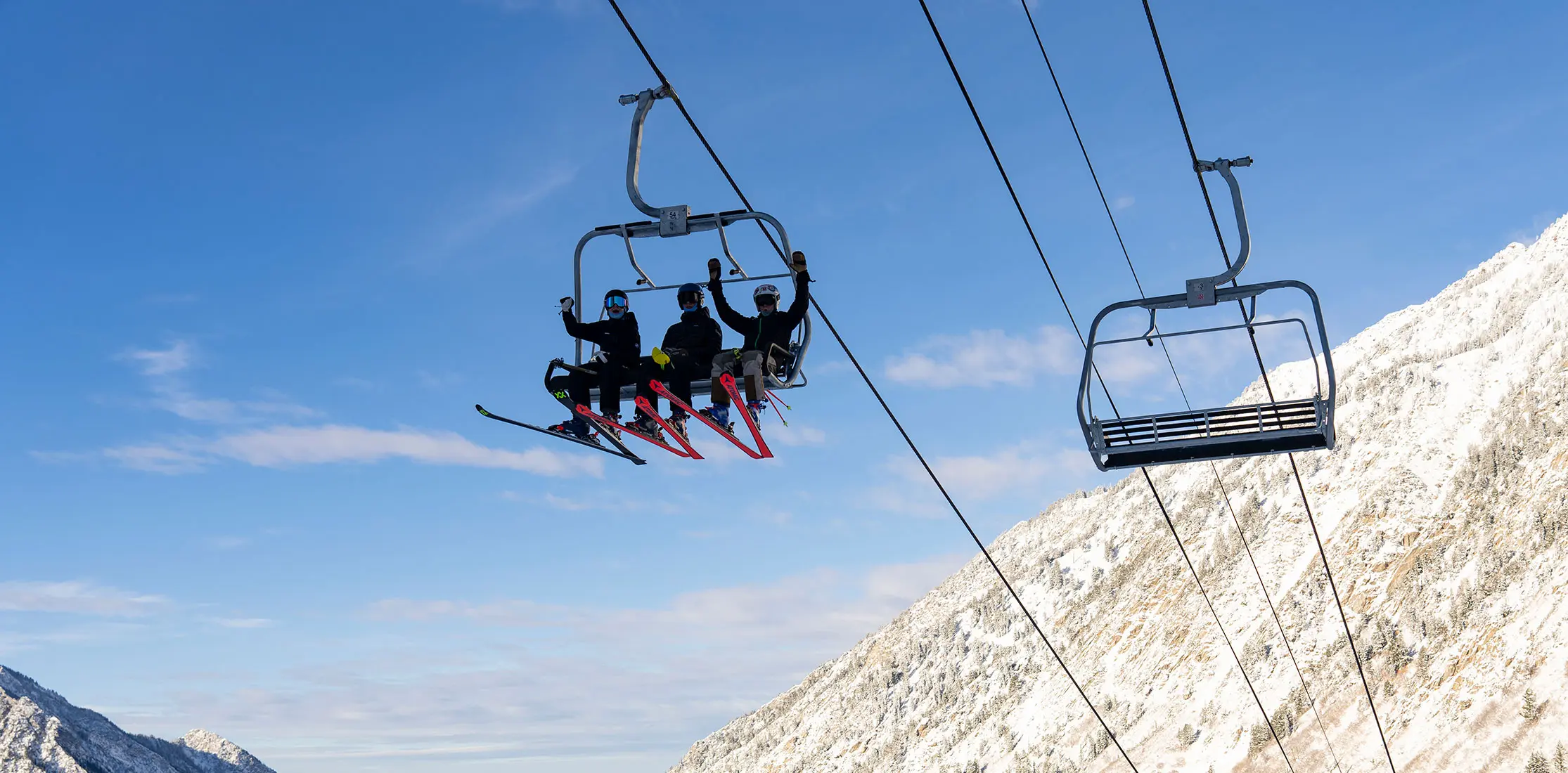 Kids on a lift stoked for the new season at Snowbird