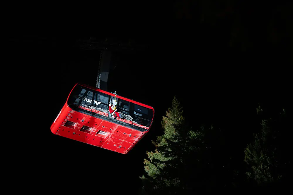 Santa descends from the red tram on Christmas Eve- a Snowbird tradition