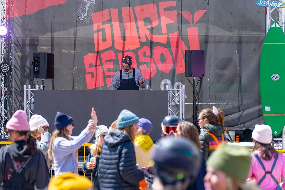 DJ playing to a crowd at Snowbird's spring concert series, Plazapalooza