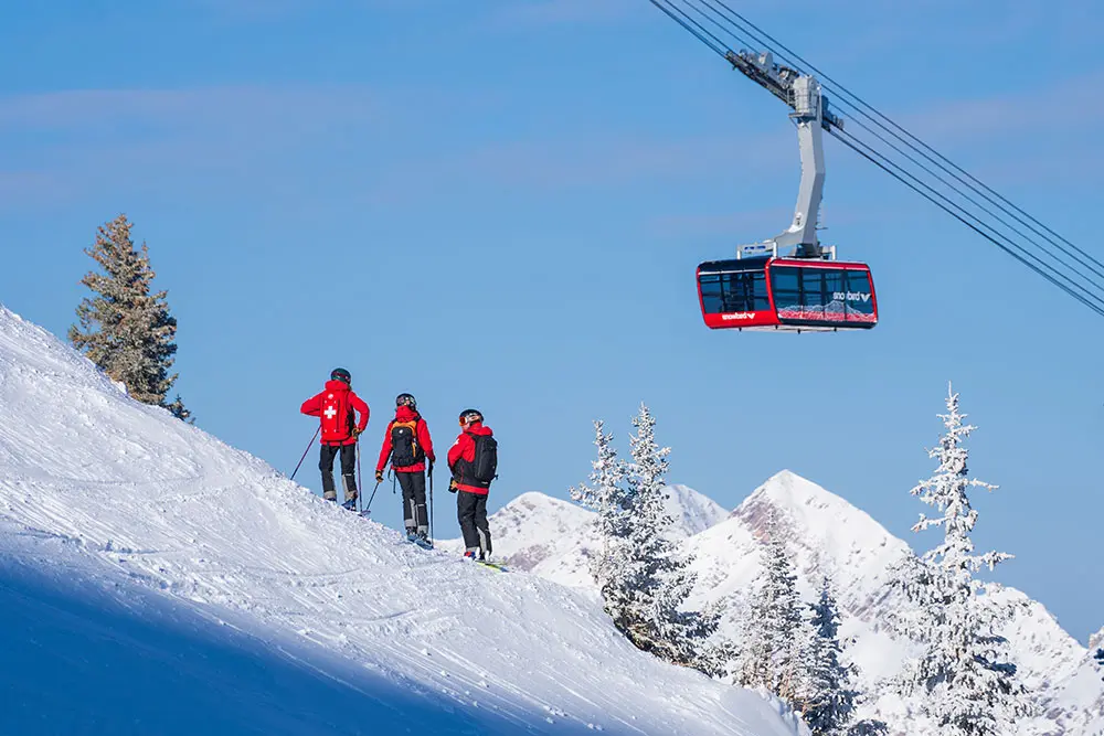 Snowbird Ski Patrol poses with the Tram.
