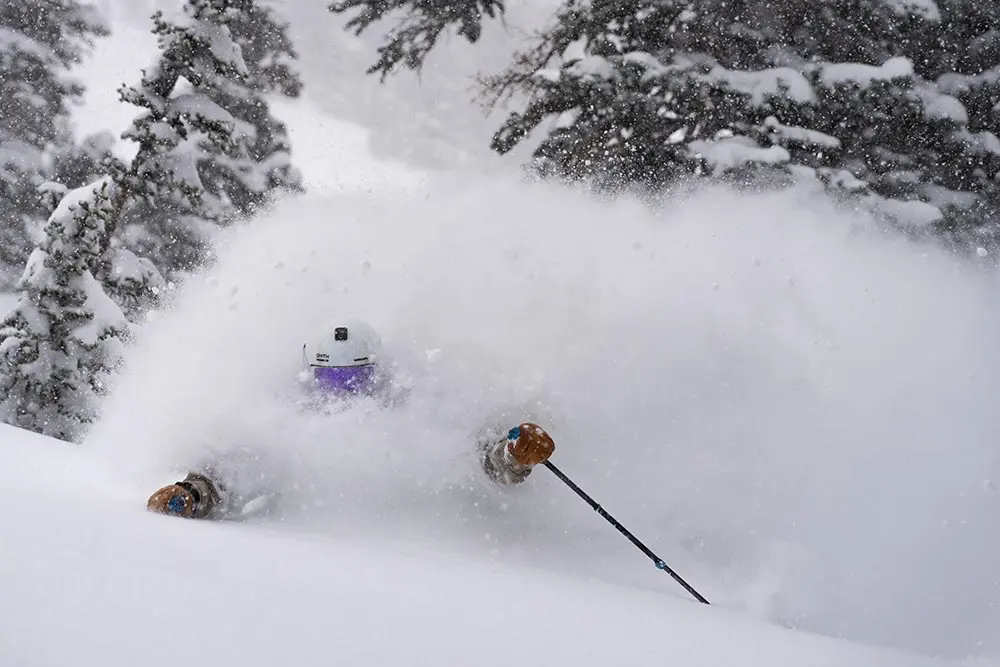 Skier in deep powder during an early January storm, just head sticking out