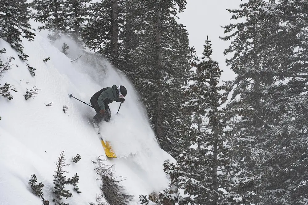 Skier enters Snowbird's get serious chutes during a February storm
