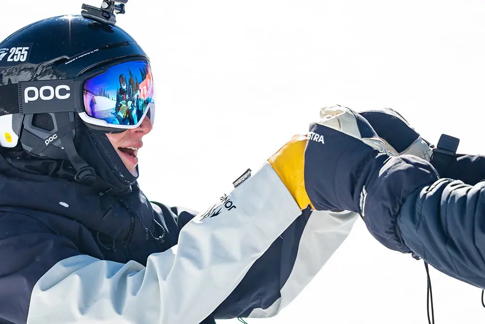 A kid gives a fist bump to an adult, freeloader passes are available for anyone 18 and under