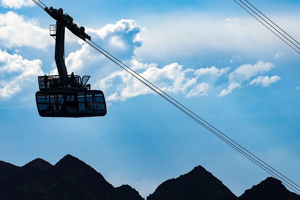 The Summer scenic tram rises above the surrounding mountains at Snowbird