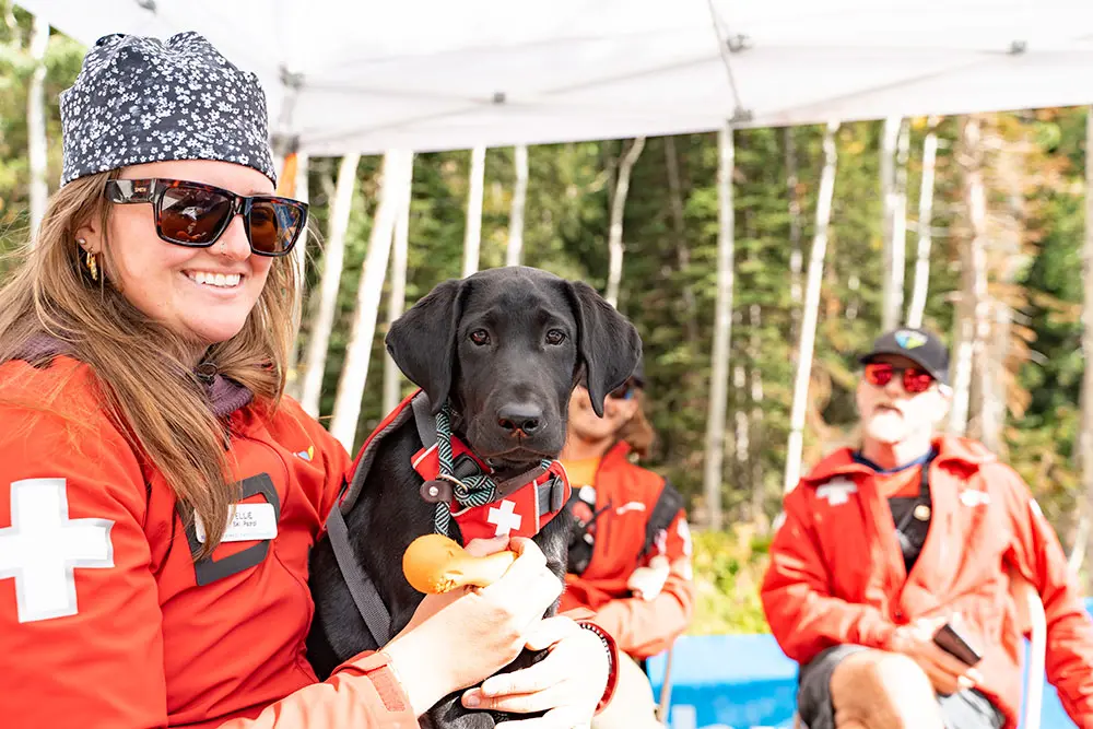 Snowbird non-profit, friends of Hidden Peak, table at Snowbird's Oktoberfest with avalanche dogs
