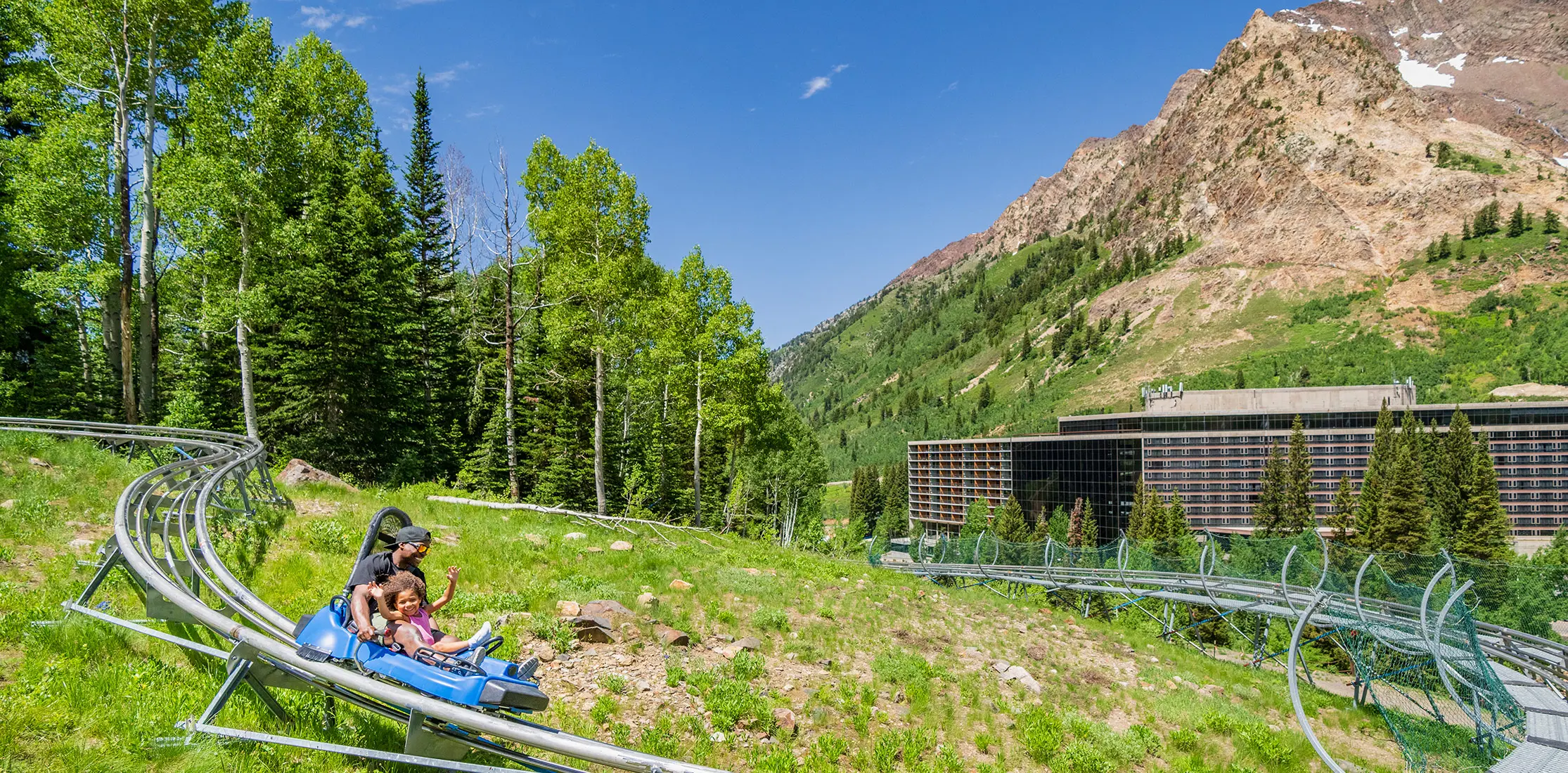 Mountain coaster at snowbird in front of the Cliff Lodge