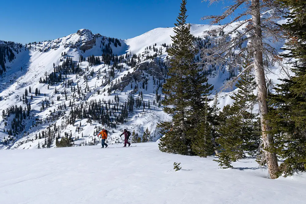 Instructor and student walk in mineral basin during a backcountry 101 course